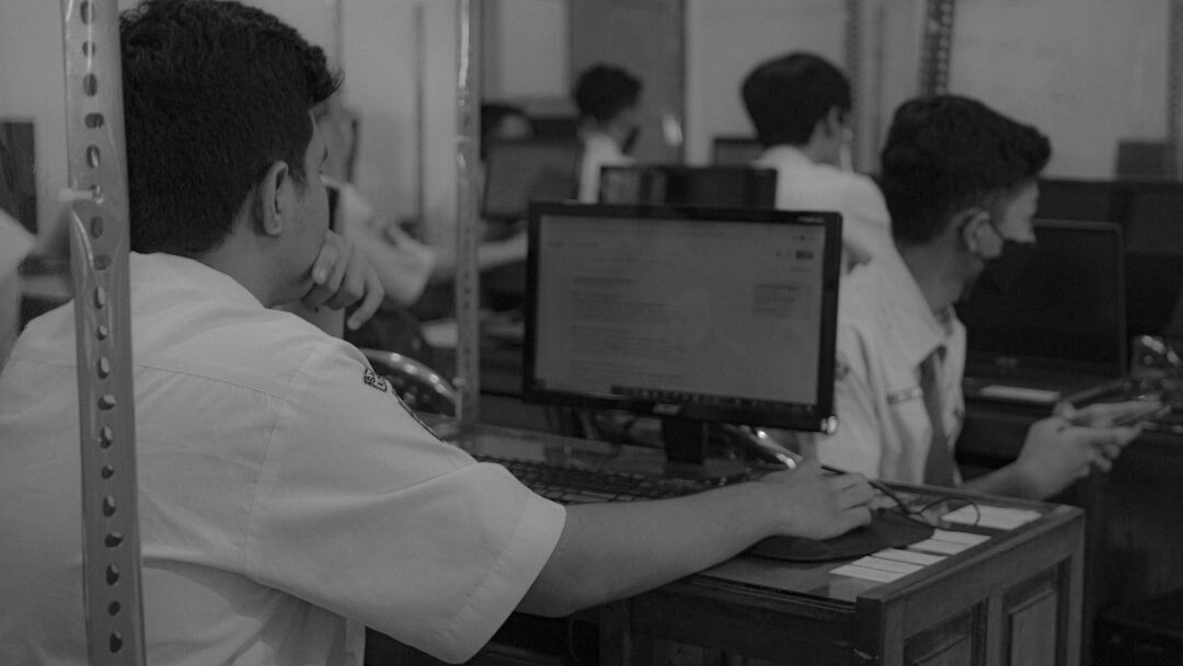 Seniors learning to use computers and tablets in a classroom