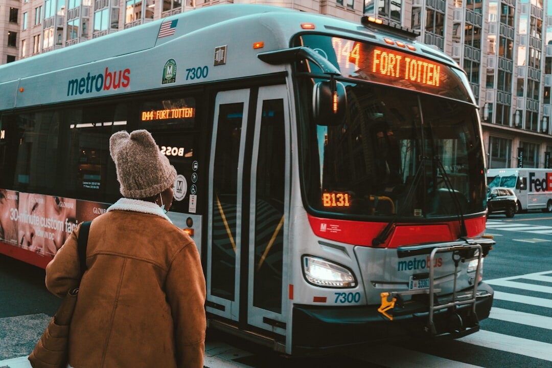 Senior woman boarding a city bus with a smile