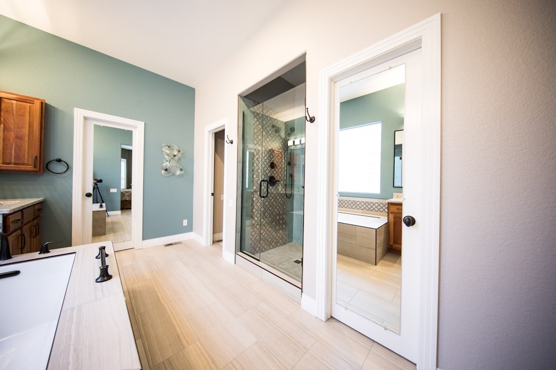 Bright renovated bathroom with handrails for accessibility
