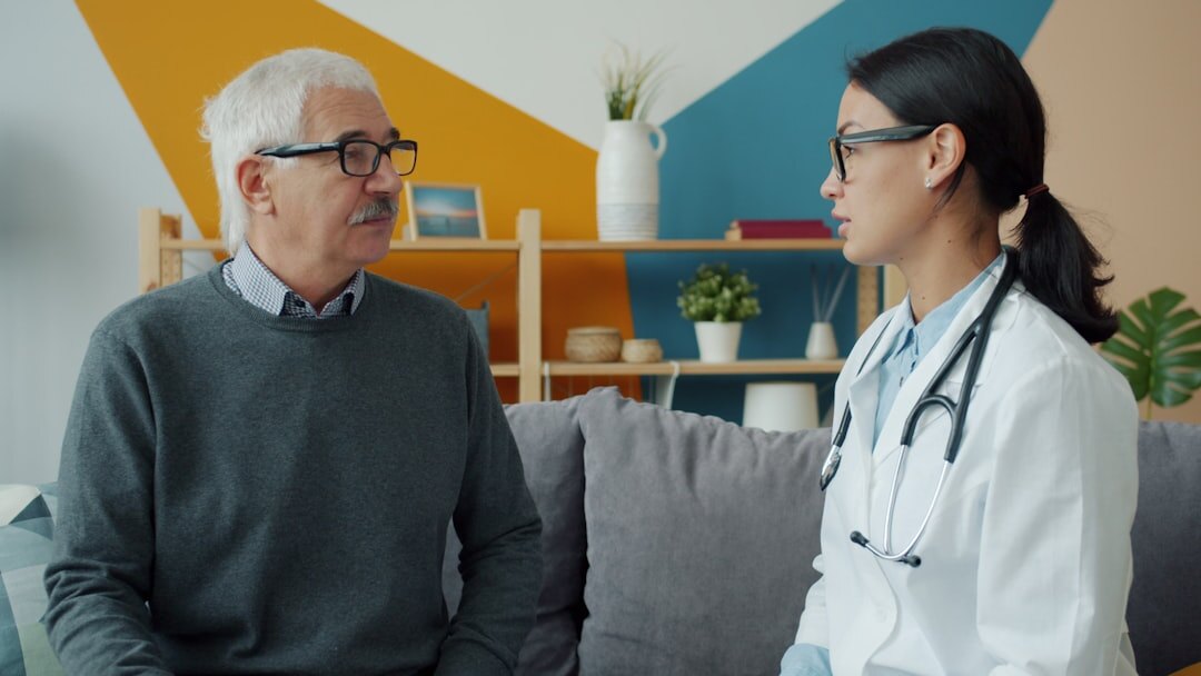 Doctor consulting with a senior patient in a bright clinic