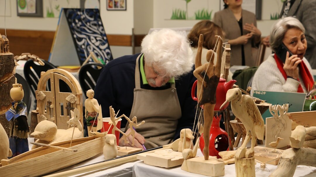 Seniors painting and doing handicrafts at a creative workshop