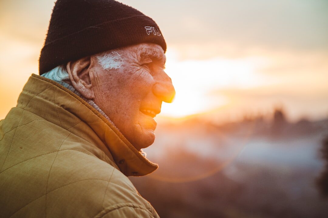 senior smiling outdoors