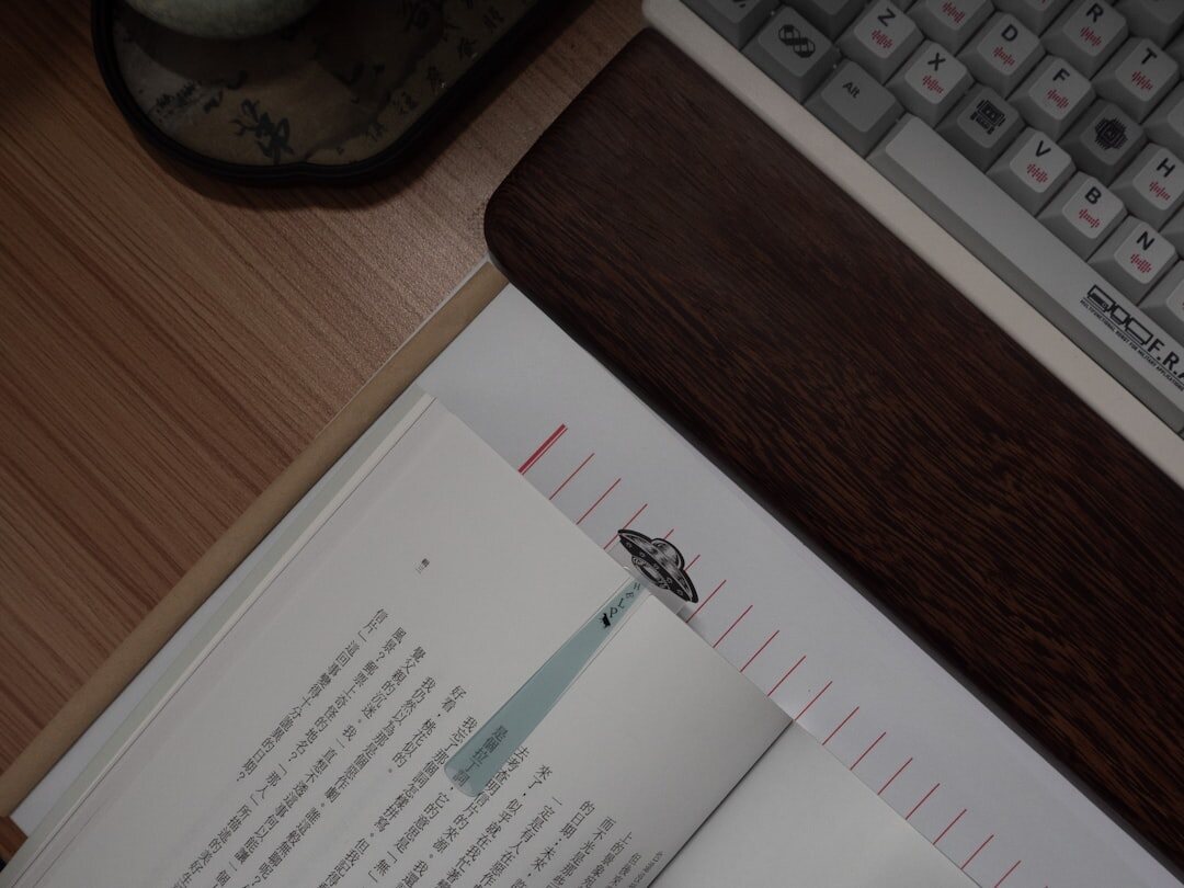 Open calendar and notebook on a wooden desk with a cup of tea