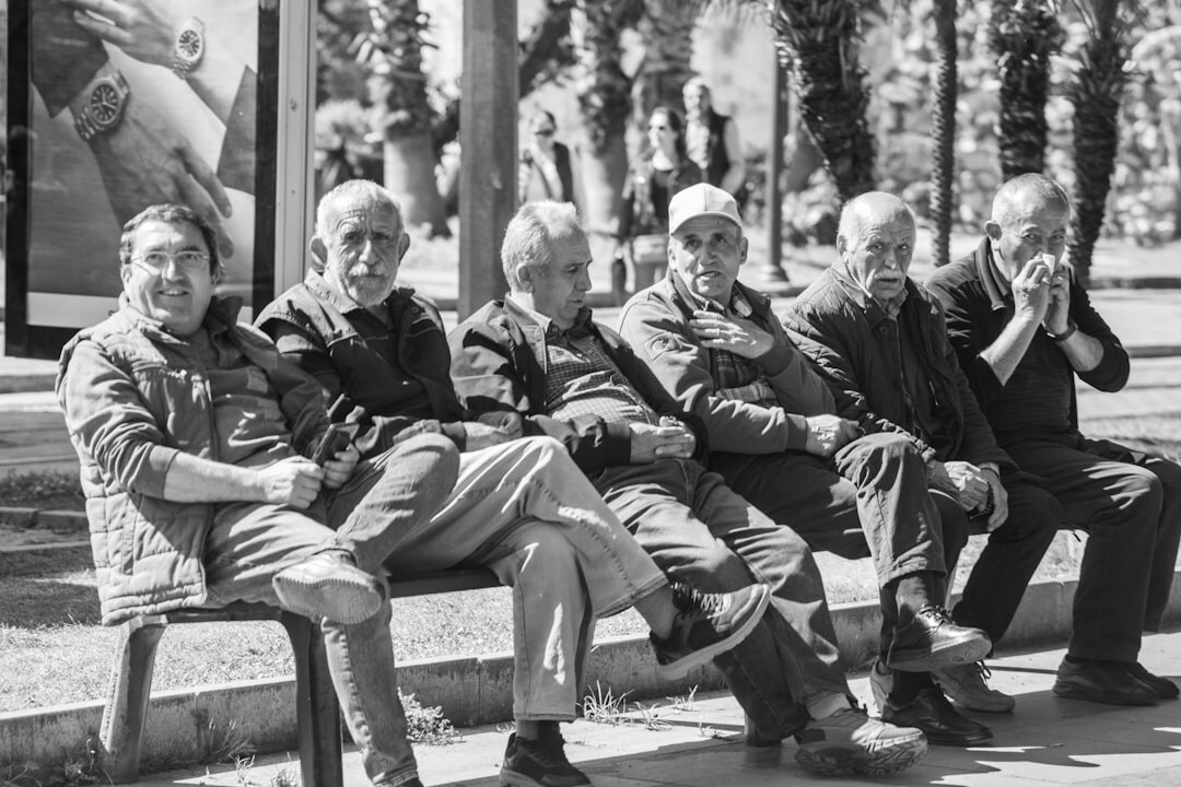 Group of active senior friends laughing together outdoors