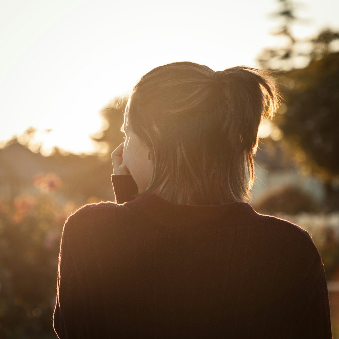 Senior woman smiling while talking on the phone at home